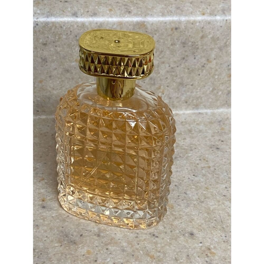Elegant GoldāTextured Perfume Bottle